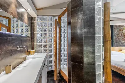 a bathroom with a sink and a bed at Spa Villa34 Family resort Renew, Relax, Revitalise in Aghia Marina
