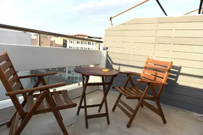 two chairs and a table on a balcony at Cozy Apartment in the Heart of Athens 8-1 in Athens