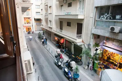 an overhead view of a city street with motorcycles parked on the sidewalk at 2the Point Athens Suites & Appartments in Plaka in Athens