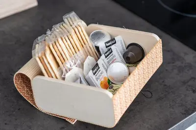 a basket filled with various items on a table at Dreamy Athens Penthouse With Acropolis View in Athens