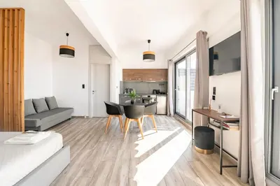 a living room with a couch and a table at Dreamy Athens Penthouse With Acropolis View in Athens