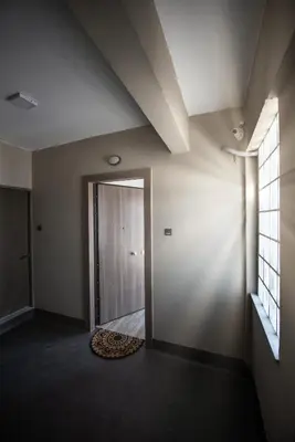 an empty room with a door and a rug at Dreamy Athens Penthouse With Acropolis View in Athens