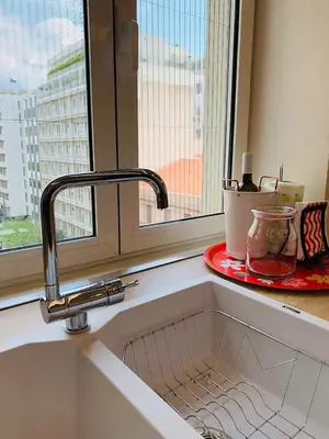 a sink in a kitchen with a window at CosmosDome. Best view in the heart of Athens! in Athens