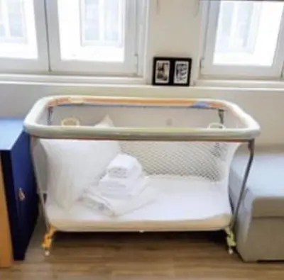 an open suitcase sitting on the floor in a room at CosmosDome. Best view in the heart of Athens! in Athens