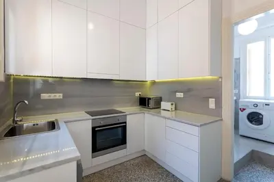 a white kitchen with a sink and a microwave at Delightful 2 BEDR-2 BATH Apt with Access to Rooftop Garden - EP9U in Athens