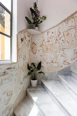 a room with stairs and a wall with animals painted on it at Delightful 2 BEDR-2 BATH Apt with Access to Rooftop Garden - EP9U in Athens