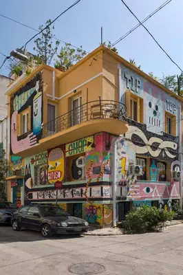a building with graffiti on the side of it at Delightful 2 BEDR-2 BATH Apt with Access to Rooftop Garden - EP9U in Athens