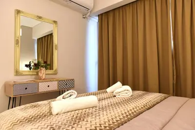 a bedroom with a bed and a mirror at Cozy Apartment in the Heart of Athens 8-2 in Athens