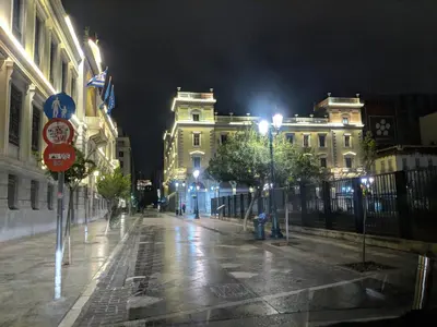 an empty city street at night with buildings at Cozy Apartment in the Heart of Athens 8-2 in Athens
