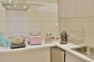 a kitchen with a counter with a toaster and a sink at Athens historical center Love suite 2 in Athens