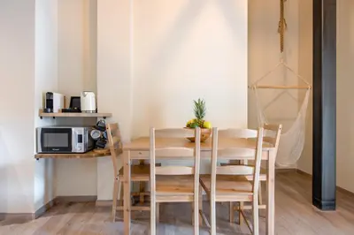 a dining room with a table and chairs at Stone house near Acropolis - Living Stone Diamond in Athens