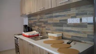 a kitchen with a sink and a counter top at The Victoria Square Apartments in Athens