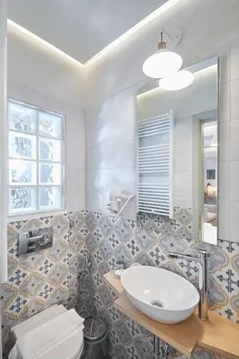 a bathroom with a sink and a mirror at Enjoy Athens from a funky studio near Acropolis! in Athens