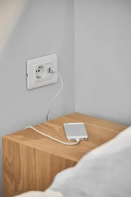 a table with a ipod plugged into a outlet at Enjoy Athens from a funky studio near Acropolis! in Athens