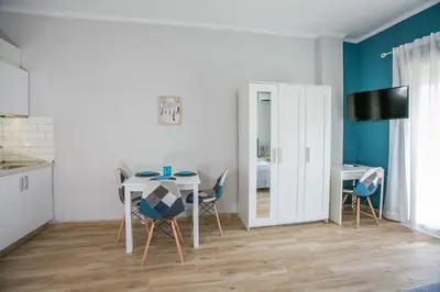 a kitchen and dining room with a table and chairs at Raise comfy studios in the heart of Athens in Athens