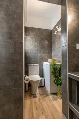 a bathroom with a toilet and a sink at Raise comfy studios in the heart of Athens in Athens