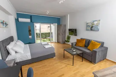 a living room with a couch and a table at Raise comfy studios in the heart of Athens in Athens