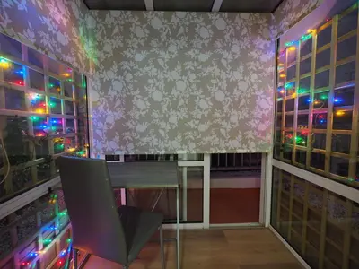 a room with a table and windows with christmas lights at Sophia's Penthouse Apartment With Jacuzzi and Acropolis View From Big Terrace in Athens
