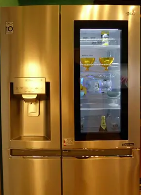 a refrigerator with its door open in a kitchen at Sophia's Penthouse Apartment With Jacuzzi and Acropolis View From Big Terrace in Athens