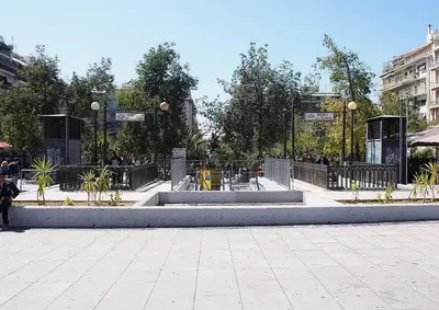 a city square with a park with people in it at Hotel Victory in Athens