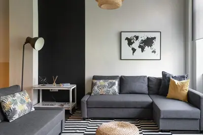 a living room with a couch and a table at Athens Downtown Loft in Athens