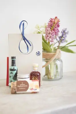 a gift box with a pair of scissors and flowers at Walk through Athens from 1-bdr next to Acropolis! in Athens