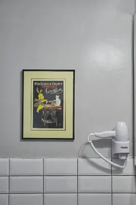 a picture in a bathroom with a picture on the wall at Walk through Athens from 1-bdr next to Acropolis! in Athens