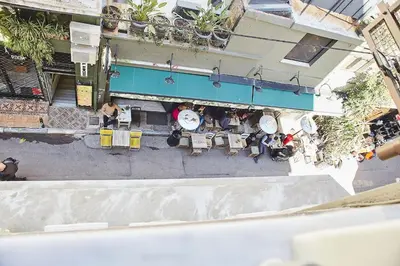an overhead view of a restaurant with tables and clocks at Walk through Athens from 1-bdr next to Acropolis! in Athens
