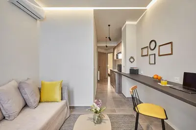 a living room with a couch and a table at Walk through Athens from 1-bdr next to Acropolis! in Athens