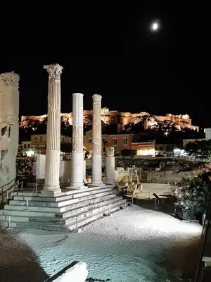 a group of columns with a moon in the background at Sunny studio with Parthenon view balcony in Athens