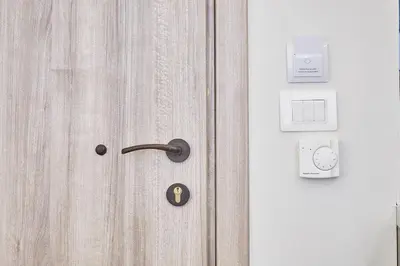 a wooden door with a key sign on it at Explore Athens from an uber-central studio! in Athens
