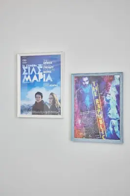 two posters of a movie on a wall at Live in a funky & renovated studio near Acropolis in Athens