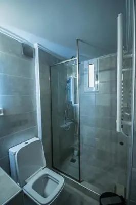 a bathroom with a shower and a toilet at ARETI in Athens
