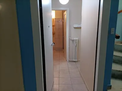 a hallway of a bathroom with a door leading to a bathroom at The Urban Escape in Athens