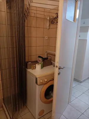 a small bathroom with a toilet and a sink at The Urban Escape in Athens