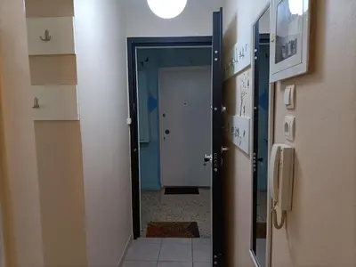 a hallway with a mirror in a room at The Urban Escape in Athens