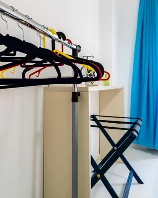 a pile of skis on a rack in a room at Koukaki Olympiou Apartment in Athens