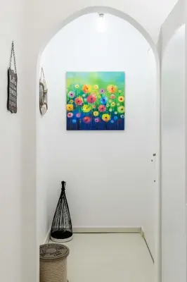 an archway in a room with a painting on the wall at Koukaki Olympiou Apartment in Athens