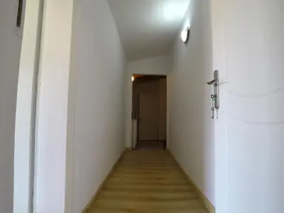 a hallway with white walls and a wooden floor at Luxury Villa with Private Pool in Keratea
