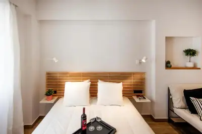 a small room with a bed and a couch at Downtown Syntagma apartment 1 in Athens