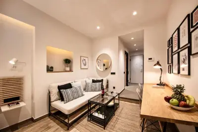 a living room with a white couch and a table at Downtown Syntagma apartment 1 in Athens
