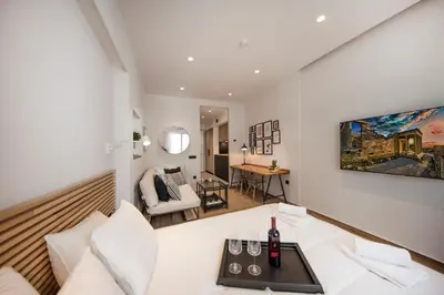 a living room with a couch and a table at Downtown Syntagma apartment 2 in Athens