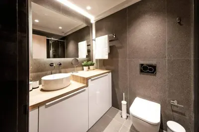 a bathroom with a white sink and a toilet at Downtown Syntagma apartment 2 in Athens