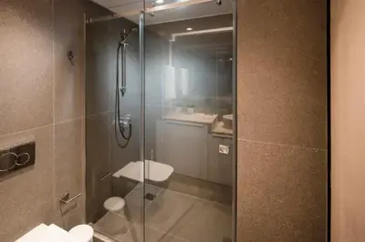 a shower with a glass door in a bathroom at Downtown Syntagma apartment 2 in Athens