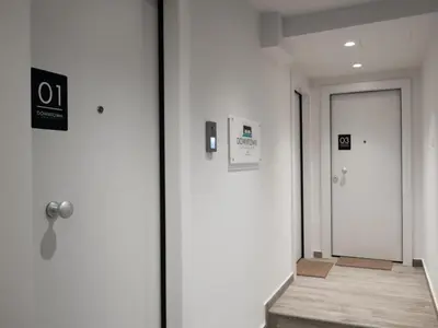 a corridor of an office with a door and a hallway with a corridorngthngth at Downtown Syntagma apartment 2 in Athens
