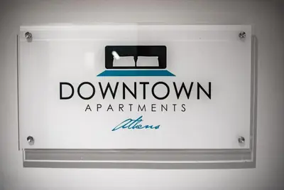 a sign for downtown apartments with a box on it at Downtown Syntagma apartment 3 in Athens
