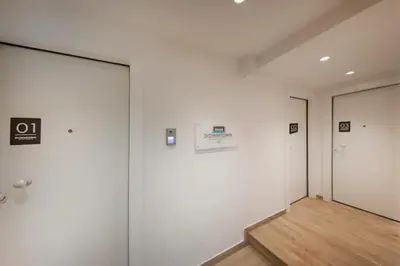 an empty room with white walls and wooden floors at Downtown Syntagma apartment 3 in Athens