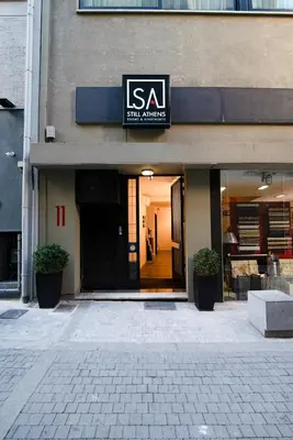 a store with a sign on the front of a building at Still Athens in Athens