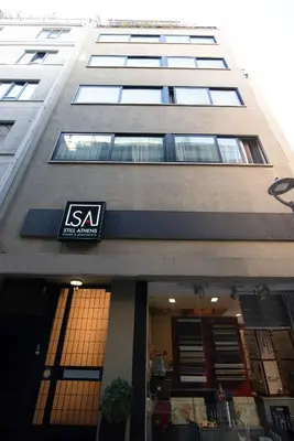 a building with a siya sign on the front of it at Still Athens in Athens