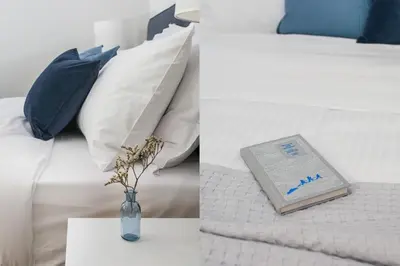 a book in a vase on a table next to a bed at Bright 2BD Apartment in Psychiko by UPSTREET in Athens